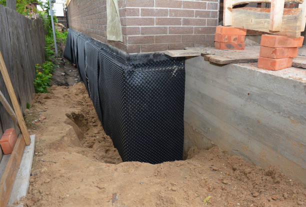 SJ Waterproofing Pros technician performing targeted Exterior Waterproofing assessment in Wichita, KS